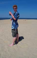 Todd Childs drinking his Coke on top of Jockey's Ridge, a huge sanddune in the Outer Banks of NC.