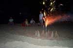 Fireworks above the fort on the beach.