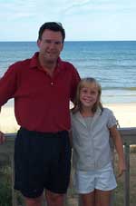 Click for a larger image of Ray and Sarah Carter on the deck of the beachhouse at Kitty Hawk, NC.