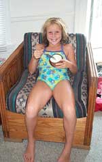 Sarah Carter eating a coconut in Kitty Hawk, NC.