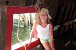 Sarah at a gunport of the Elizabeth II, a reproduction of the ship that brought colonists to Roanoke Island in NC 1584-87.