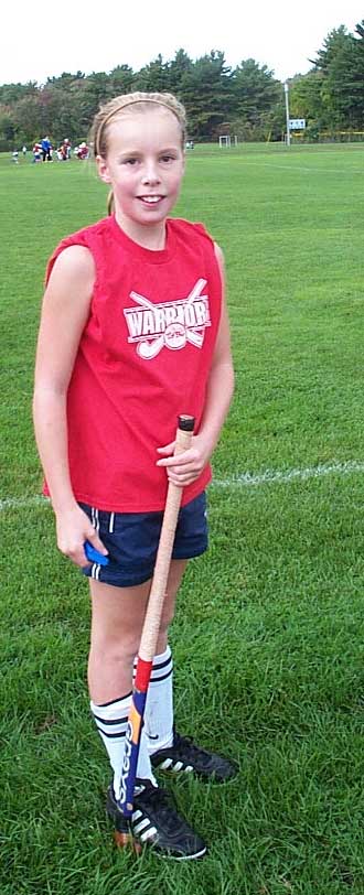 Sarah with field hockey gear.