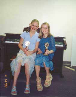 Sarah with her cousin, Jeannine, at the April 2003 recital.  Notice the trophies.