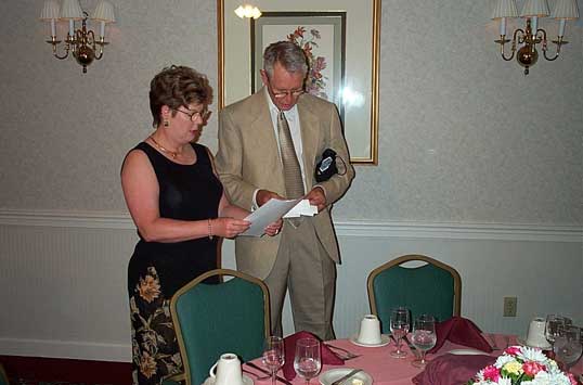 Candace and Doss setting out the placecards for the dinner.