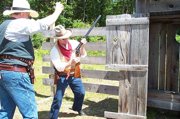 Shucking shells from his double-barreled shotgun.