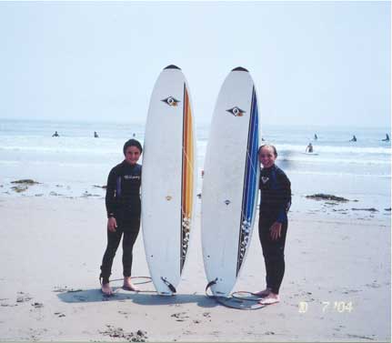 Sarah and her friend Emily surfing at Hampton Beach, NH.